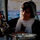 The woman selling tea.