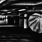 The woman with the umbrella (203);.....in the parking garage....