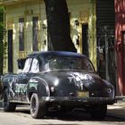 The yellow house, the old car and the tattoo