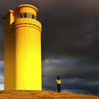 The yellow lighthouse and the tourist