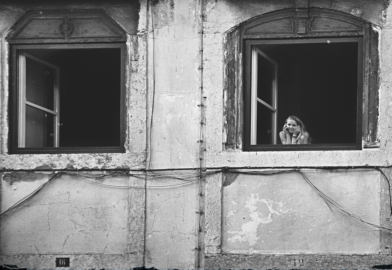 THE YOUNG LADY IN THE WINDOW