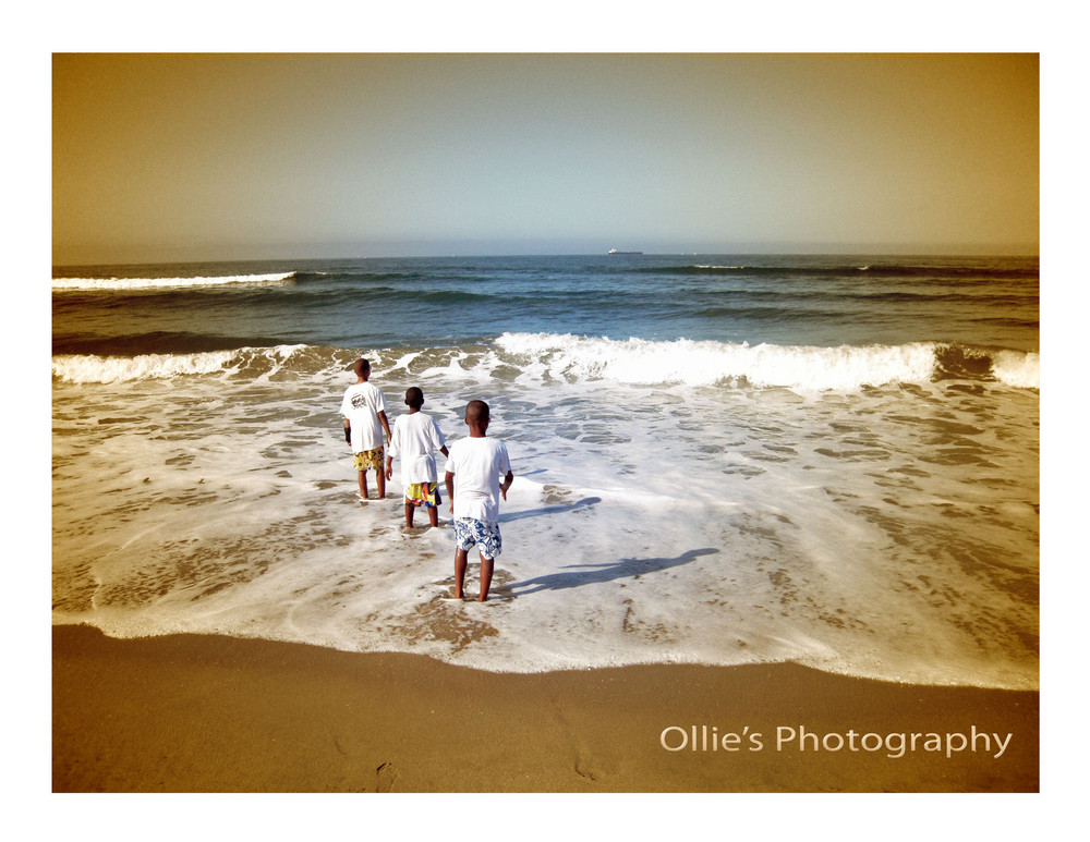 Three boys on a beach