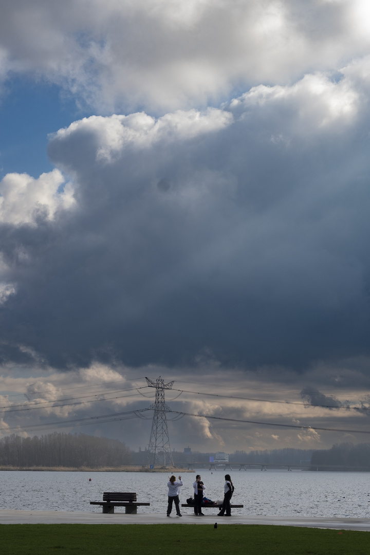 Three girls with dramatic sky