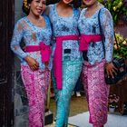 Three ladies welcome wedding guests