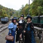 " three pretty ladies waiting for the train "