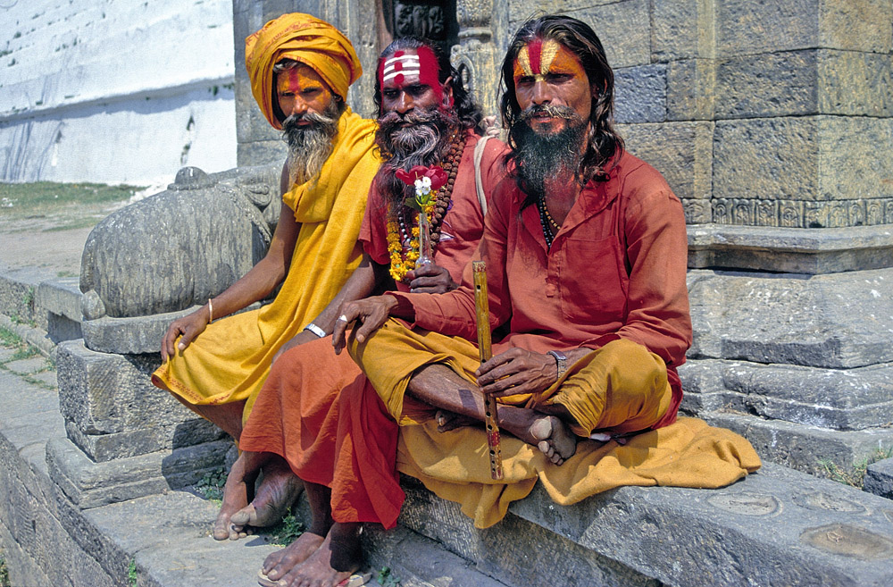Three Saddhus present themselves for photo shoots