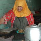 TORTOISE SHELL BORNEO WOMAN COOKING AT ROADSIDE CAFE