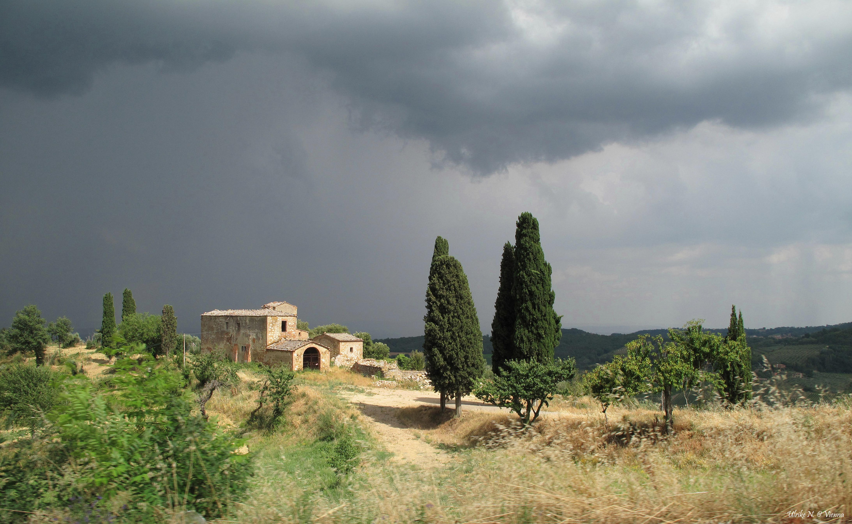 Toscana con sole e pioggia