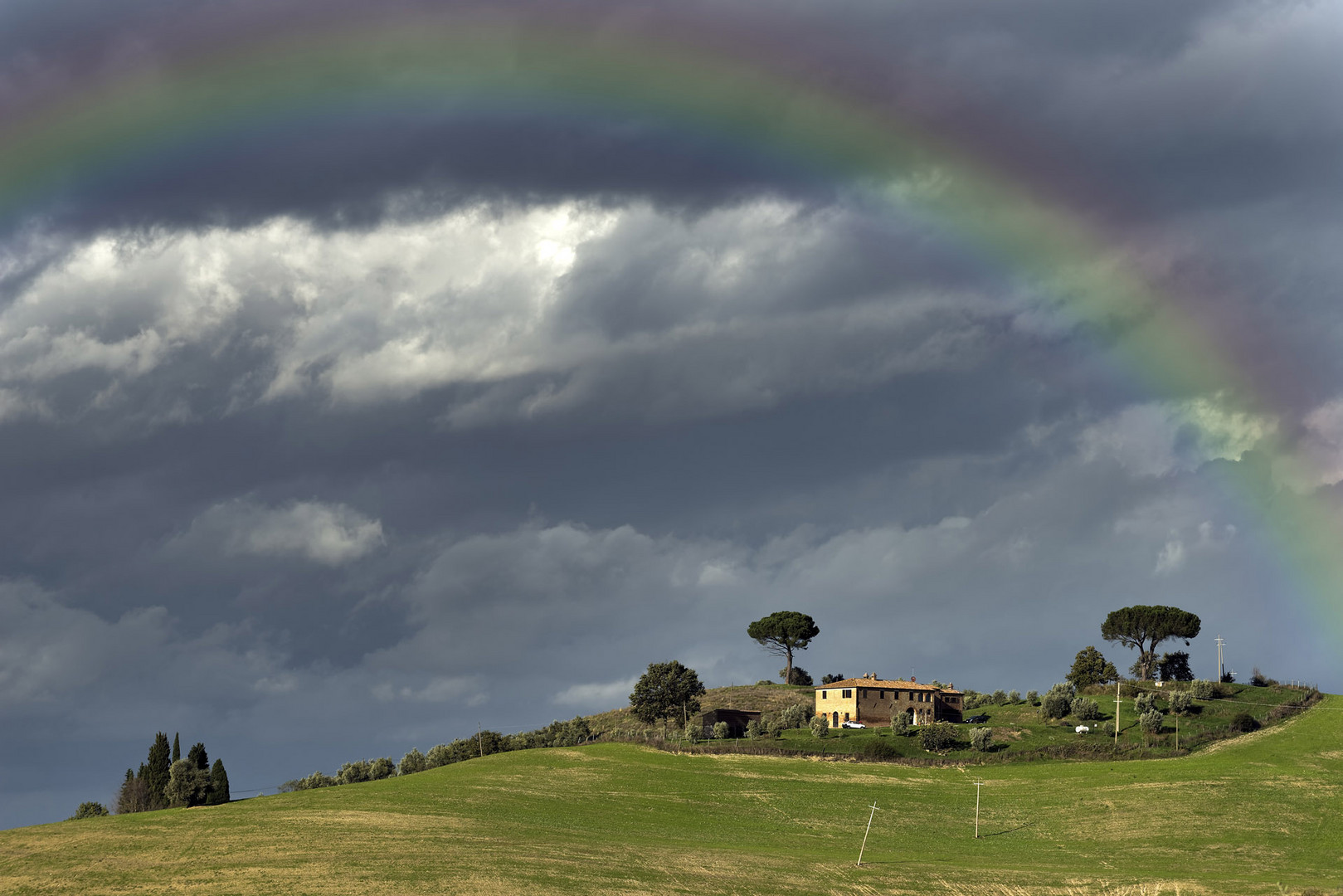 Toscana Landschaft Crete Gewitterstimmung mit Regenbogen