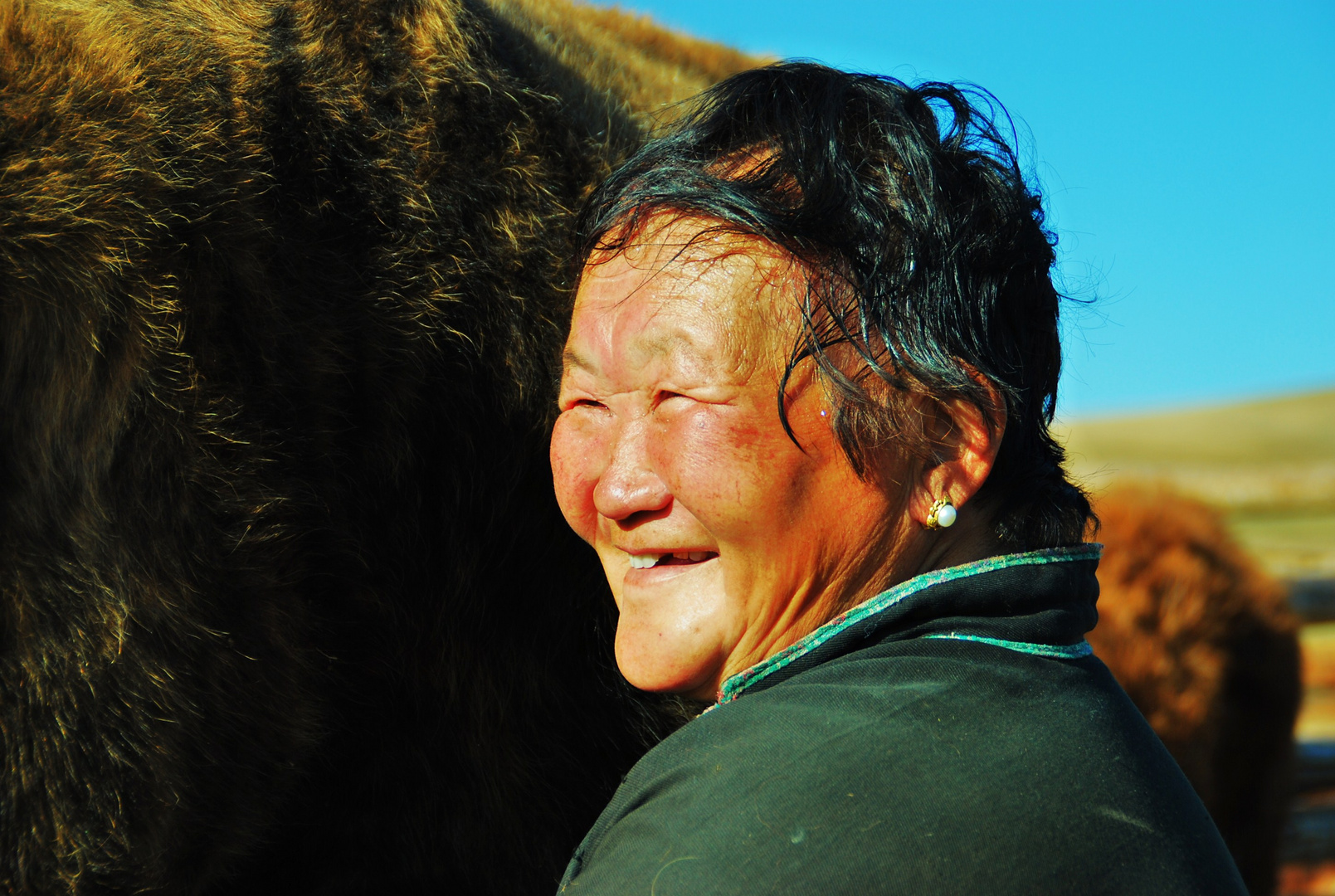 toujours avec le sourire