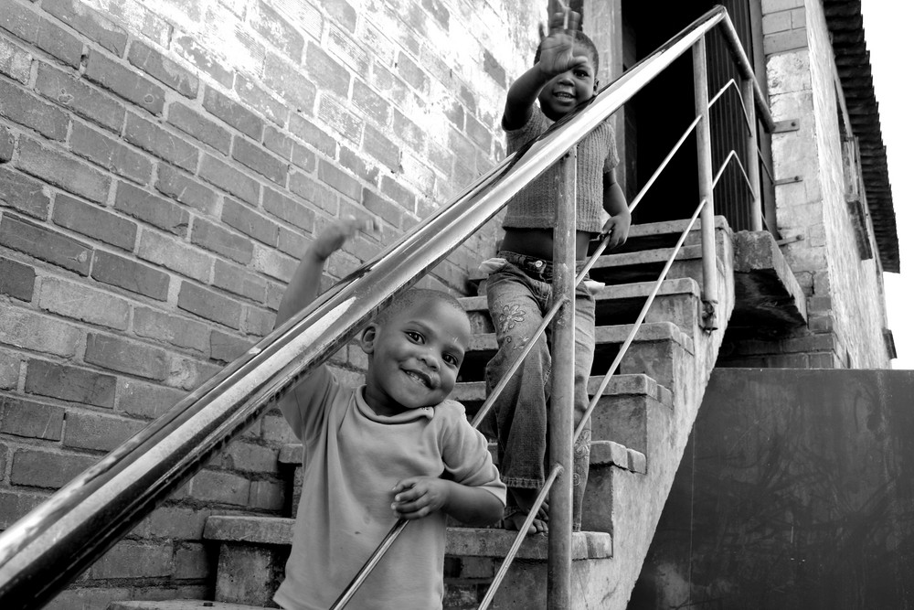 Township kids on stairs