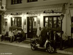 traditional greek coffeehouse in the evening