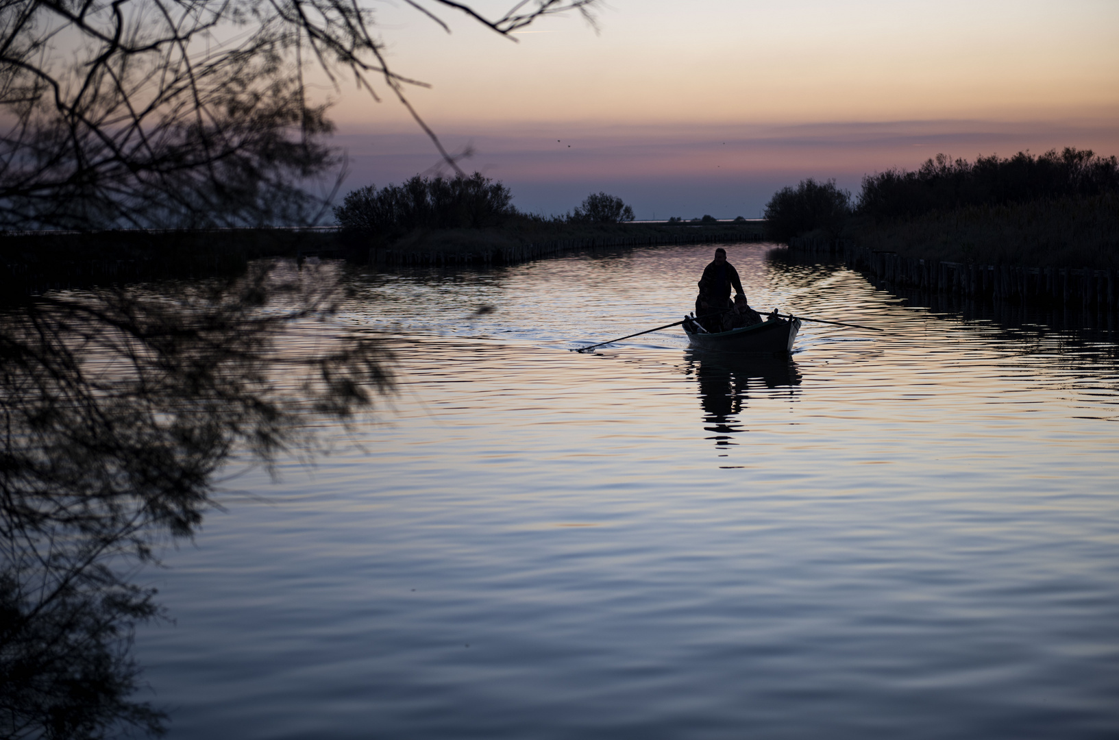 Tramonto e pescatori del delta