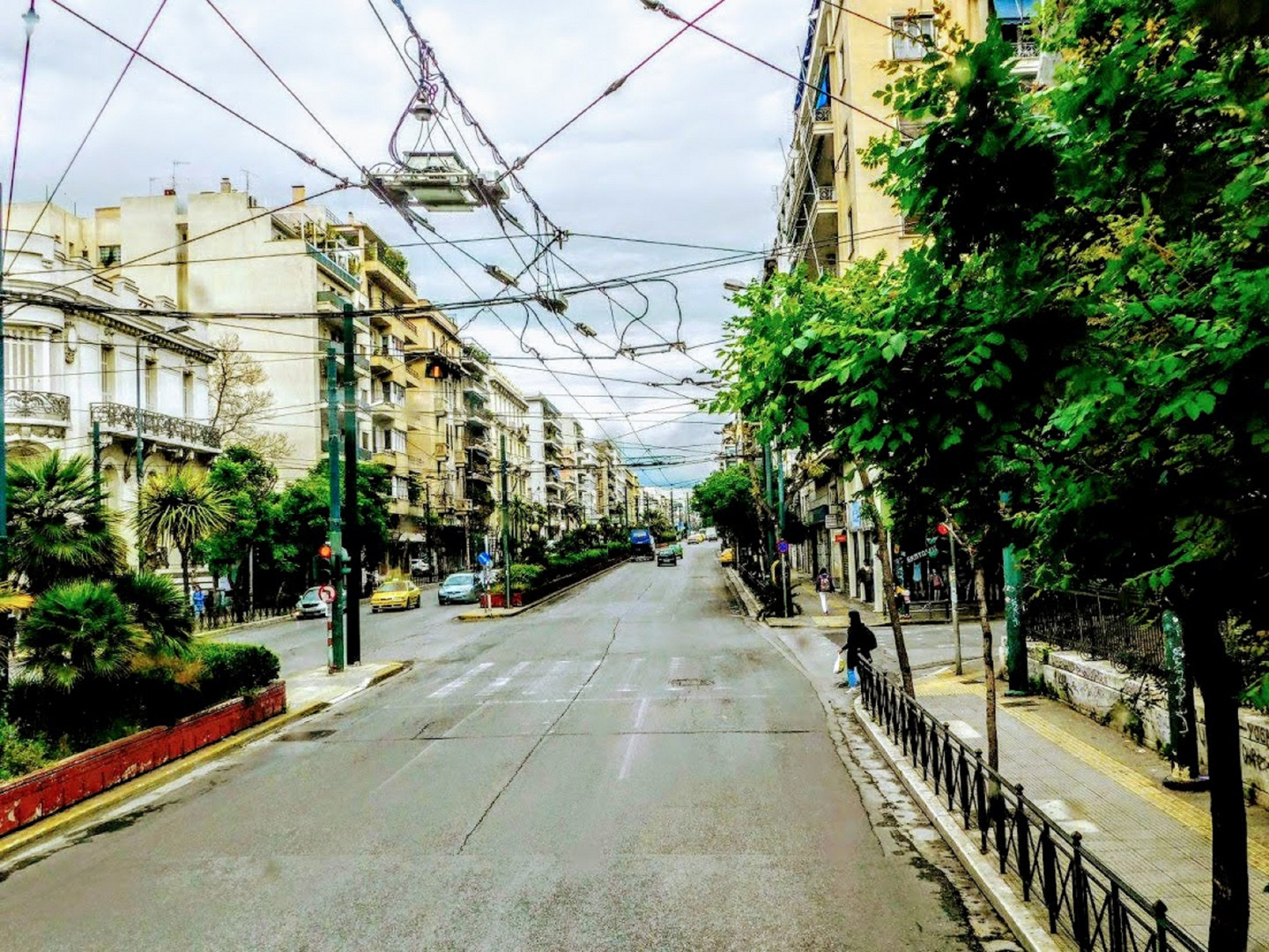 Trollei lines on sky above street in central Athens Greece