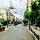 Trollei lines on sky above street in central Athens Greece