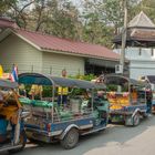 Tuk tuks waiting in Thonburi