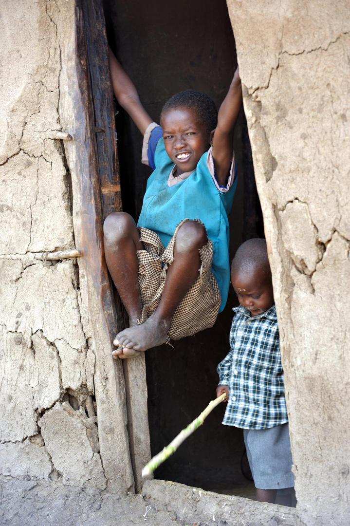 two boys attending the door