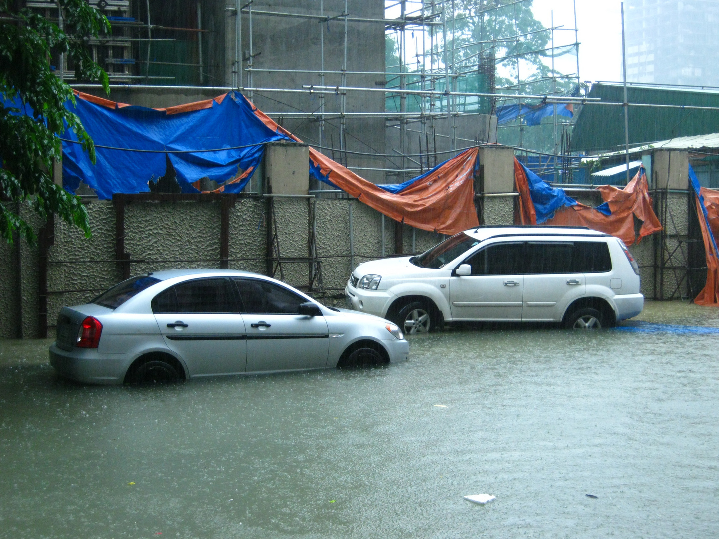 Two Cars on A Floody Float