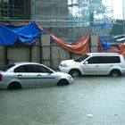 Two Cars on A Floody Float