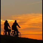 Two girls bicycling home