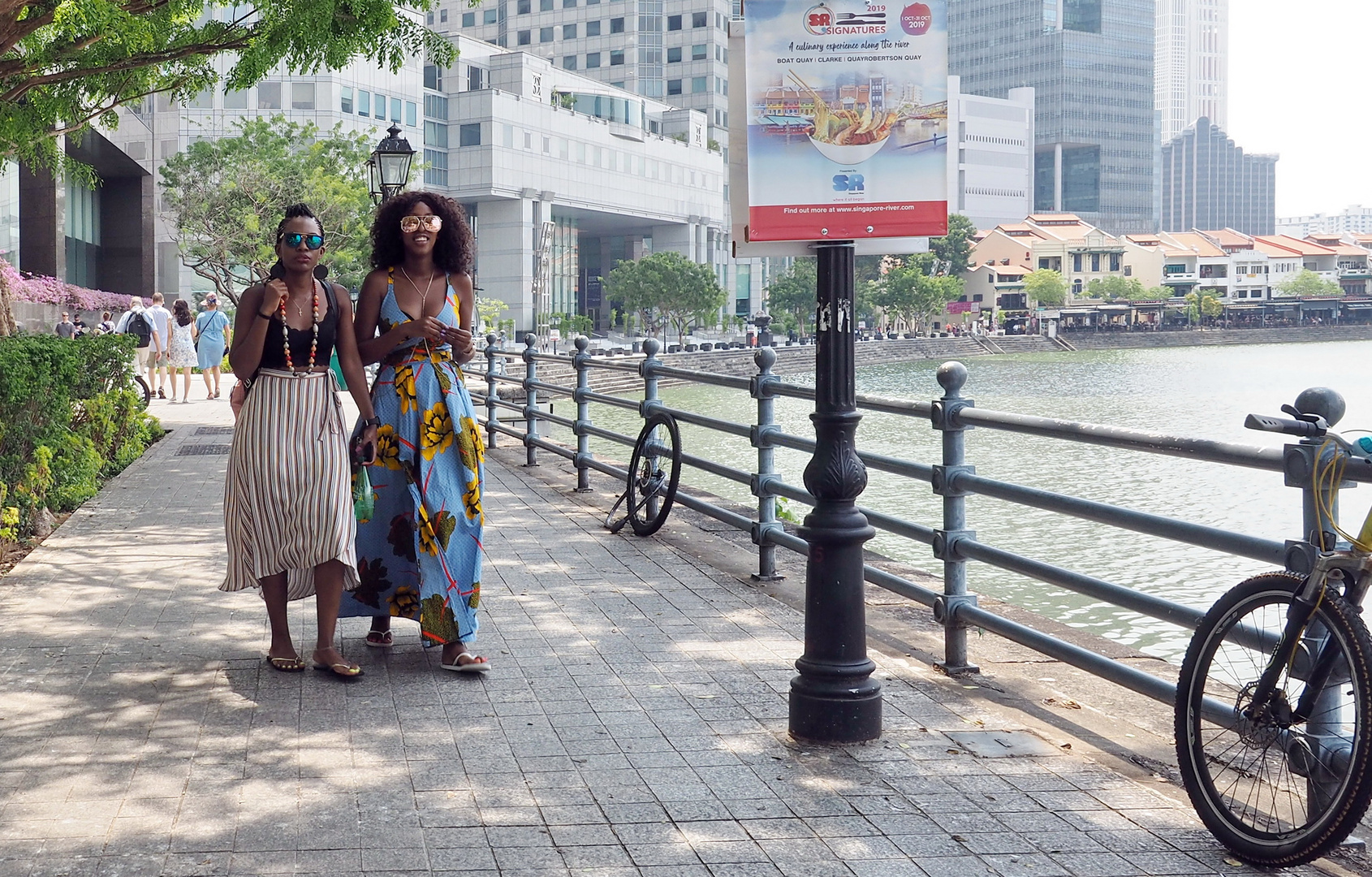 Two ladies walking along the river