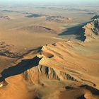 Two little white planes over the Namib Desert