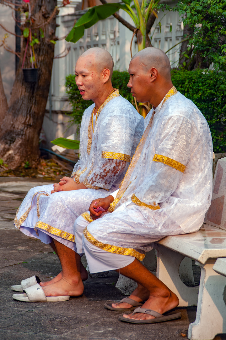 Two men before getting monks