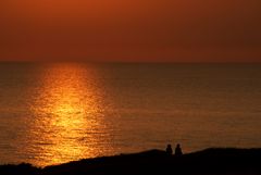 Two men watching the sunset