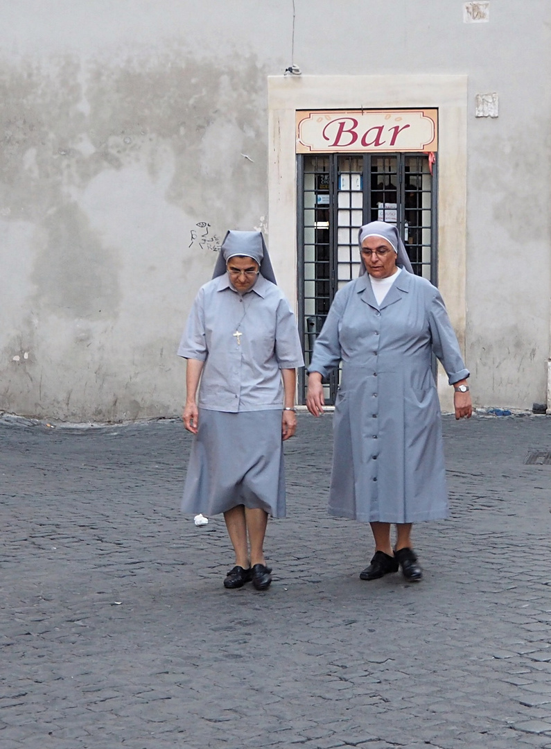 two nuns walk out the bar, and ...