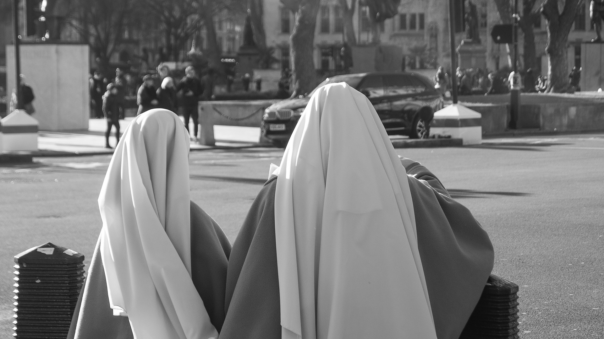 - two nuns walking down the road -