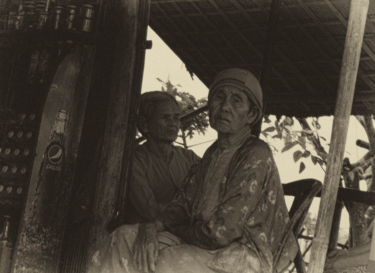 Two Old Woman in Vietnam in their Kiosk