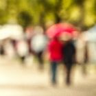 Two people and a red umbrella