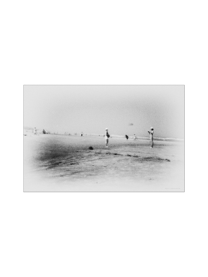 two woman playing on the beach