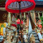 Umbrella above the statues