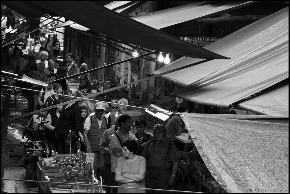 Under the awnings of the market