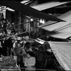 Under the awnings of the market