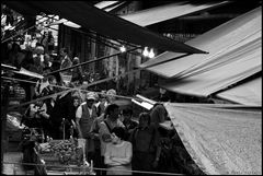 Under the awnings of the market