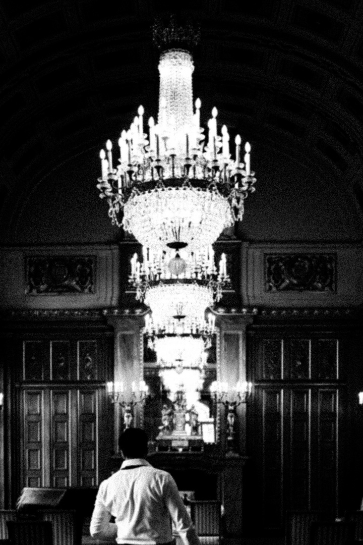 Under the chandelier