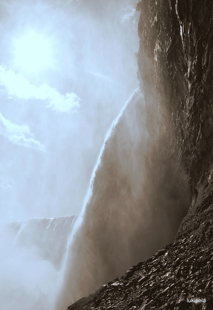 under the waterfall