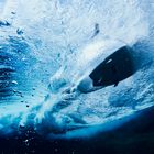 Underwater view of surfing