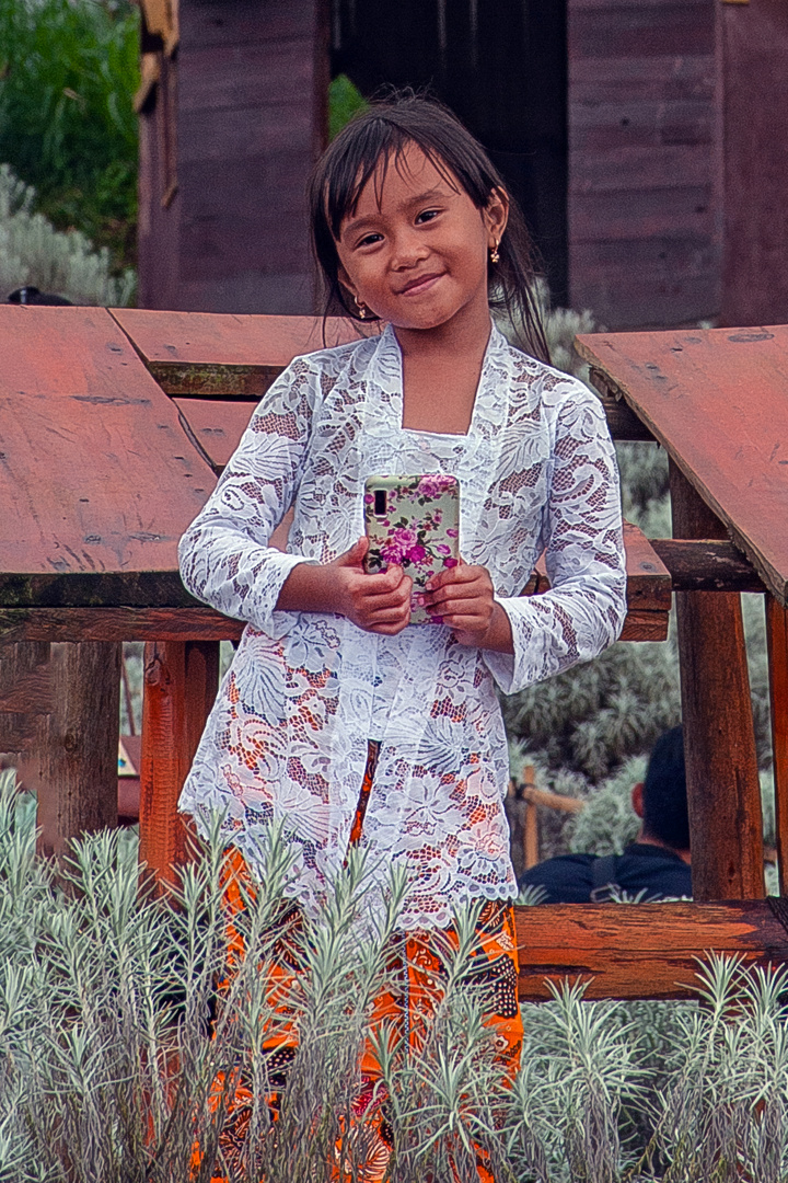 Unknown schoolgirl with her smartphone