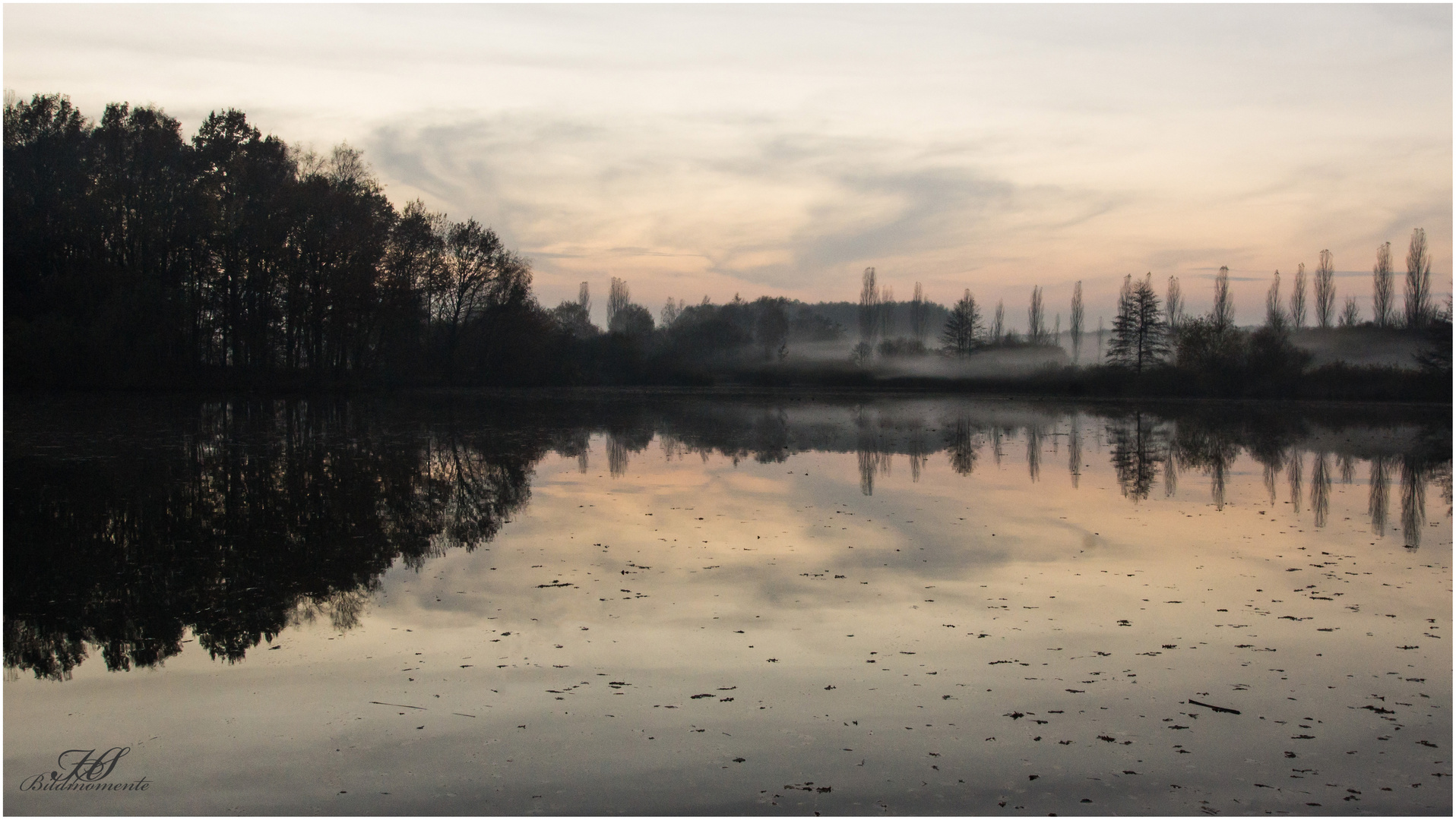 Untergehende Sonne mit aufsteigenden Nebel