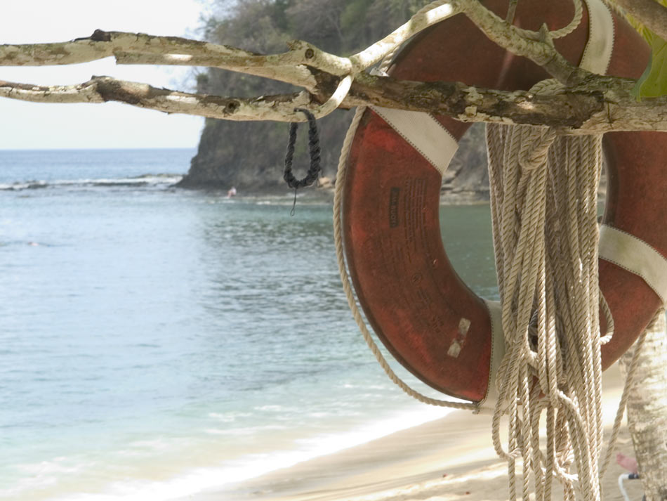 UNUSED LIFEBELT ON A HOTEL BEACH IN TOBAGO