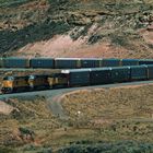 UP#9547 is leading a Train with Enclosed Auto Carrier Gondolas, Echo Canyon,UT