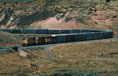 UP#9547 is leading a Train with Enclosed Auto Carrier Gondolas, Echo Canyon,UT