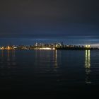 Vancouver Skyline at night with a tanker in the harbour - Burrard Inlet