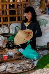 Vendor girl selling dried fish