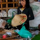 Vendor girl selling dried fish