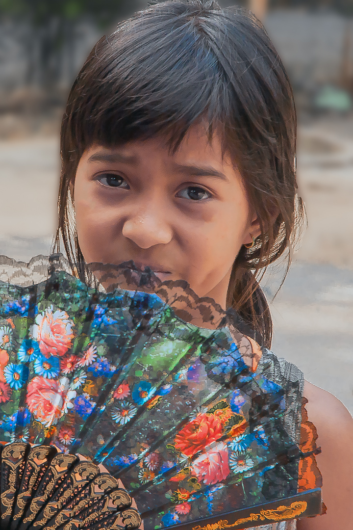 Vendor girl sells fans