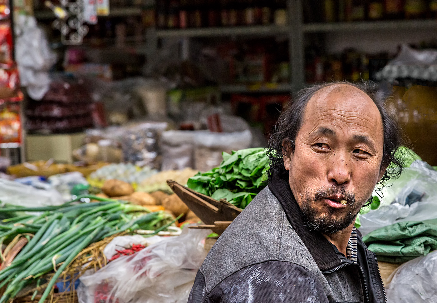 Verkäufer auf dem Markt in Kunming
